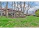 Lush backyard with mature trees and landscaping, offering a serene outdoor space at 102 Knoll Ct # D, Noblesville, IN 46062