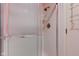 Shower featuring tiled walls, glass doors and chrome fixtures at 102 Knoll Ct # D, Noblesville, IN 46062