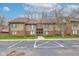Exterior view of the building with well-kept landscaping and ample parking at 102 Knoll Ct # D, Noblesville, IN 46062
