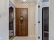Inviting condo entryway featuring a decorative door, tile flooring, and an adjacent closet at 102 Knoll Ct # D, Noblesville, IN 46062