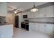 Bright kitchen with white cabinets, stainless steel appliances, and tile floor at 102 Knoll Ct # D, Noblesville, IN 46062