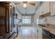 Bright kitchen featuring white cabinets, granite countertops, and stainless steel appliances at 102 Knoll Ct # D, Noblesville, IN 46062
