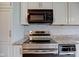 Modern kitchen showcasing stainless steel appliances and white cabinetry at 102 Knoll Ct # D, Noblesville, IN 46062