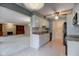 Open concept kitchen with white cabinets, granite counters, and view of the living room at 102 Knoll Ct # D, Noblesville, IN 46062
