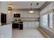 Bright kitchen with white cabinets, stainless steel appliances, and granite countertops at 102 Knoll Ct # D, Noblesville, IN 46062