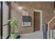 Common mail area with mailboxes, a corkboard, and a potted plant, featuring brick walls at 102 Knoll Ct # D, Noblesville, IN 46062
