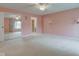Large main bedroom featuring a closet with mirrored doors, fan, and ensuite bathroom at 102 Knoll Ct # D, Noblesville, IN 46062