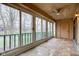 Bright sunroom with floor-to-ceiling windows, tile flooring, and outdoor view at 102 Knoll Ct # D, Noblesville, IN 46062