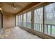 Bright sunroom with floor-to-ceiling windows, tile flooring, and outdoor view at 102 Knoll Ct # D, Noblesville, IN 46062