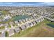 Overhead perspective of the residential area, complete with picturesque pond and cozy homes in a grid layout at 1075 Barberry Dr, Greenwood, IN 46143