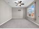 Neutral bedroom with carpet, ceiling fan, and a large window for ample natural light at 1075 Barberry Dr, Greenwood, IN 46143