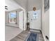 Bright entryway featuring wood-look floors and a decorative glass front door at 1075 Barberry Dr, Greenwood, IN 46143