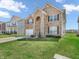 Charming two-story brick home featuring a well-manicured lawn and a two-car attached garage at 1075 Barberry Dr, Greenwood, IN 46143