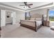 An inviting main bedroom with ceiling fan, tray ceiling, and a comfortable style at 1075 Barberry Dr, Greenwood, IN 46143