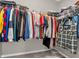 Well-organized walk-in closet with clothing racks and shelves featuring a variety of clothes and accessories at 1075 Barberry Dr, Greenwood, IN 46143