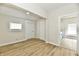 A bedroom with wood flooring, a closet, a window and an opening for light at 1145 N Belleview Pl, Indianapolis, IN 46222