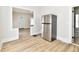 A bright kitchen with stainless steel appliances and light, wood-look flooring at 1145 N Belleview Pl, Indianapolis, IN 46222