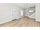 Bright living room with light-colored wooden floor and staircase at 1145 N Belleview Pl, Indianapolis, IN 46222