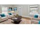 Bright living room with a front door, two armchairs, rug and modern decorations at 1145 N Belleview Pl, Indianapolis, IN 46222
