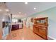 Bright, open kitchen area leading to a hallway, with a view of dining area and natural light at 115 King Arthur Dr, Franklin, IN 46131
