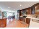Modern kitchen with dark wood cabinets, stainless steel appliances, and a stylish backsplash at 115 King Arthur Dr, Franklin, IN 46131
