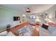 Inviting living room featuring hardwood floors, comfortable seating, and plenty of natural light at 115 King Arthur Dr, Franklin, IN 46131