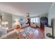 Comfortable living room with hardwood floors, neutral paint, and ample seating at 115 King Arthur Dr, Franklin, IN 46131