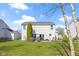 This backyard offers a patio with table and an abundance of greenspace at 11741 Langham Crescent Ct, Fishers, IN 46037