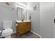 Powder room featuring a gray walls, turtle decor and wood cabinets at 11741 Langham Crescent Ct, Fishers, IN 46037