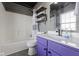 This bathroom includes updated shelves, cabinets, sink and shower/tub combo at 11741 Langham Crescent Ct, Fishers, IN 46037