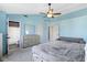 Spacious bedroom features a ceiling fan, seating area and ensuite bathroom access at 11741 Langham Crescent Ct, Fishers, IN 46037