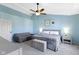 This bedroom offers a ceiling fan, decor, sitting area and neutral color carpet and paint at 11741 Langham Crescent Ct, Fishers, IN 46037