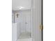 Neutral colored hallway with white doors and white trim, and a cross decor at 11741 Langham Crescent Ct, Fishers, IN 46037
