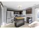 Modern kitchen featuring stainless steel appliances, a butcher block island, and ample cabinet space at 11741 Langham Crescent Ct, Fishers, IN 46037