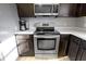 Stainless steel oven and microwave next to countertop with stainless steel dishwasher at 11741 Langham Crescent Ct, Fishers, IN 46037