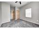 Cozy bedroom with a large window, gray walls, closet space, and soft, gray carpeting at 11975 Civic Cir, Mooresville, IN 46158
