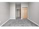 This bedroom has plush carpet and natural wood closet and interior doors at 11975 Civic Cir, Mooresville, IN 46158