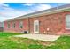 This home features a full brick exterior and a concrete patio in the backyard at 11975 Civic Cir, Mooresville, IN 46158