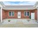 Charming brick home featuring a white front door, large windows, and stone landscaping for added curb appeal at 11975 Civic Cir, Mooresville, IN 46158
