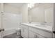 This bathroom is well lit with a dual vanity, granite countertop, and tub shower at 12009 Jeff Ct, Noblesville, IN 46060