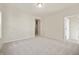 This spacious bedroom has neutral walls, carpet, and access to the ensuite bathroom at 12009 Jeff Ct, Noblesville, IN 46060