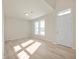 Bright living room showcasing wood floors, a large window, and a neutral color palette at 12009 Jeff Ct, Noblesville, IN 46060