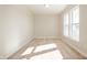 Bright, open living room featuring neutral paint and lots of natural light from the large windows at 12009 Jeff Ct, Noblesville, IN 46060