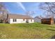 Sprawling backyard with lush lawn, shed, and mature trees at 12527 Saksons Blvd, Fishers, IN 46038