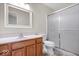 Bathroom featuring wood vanity with sink, toilet, and shower with sliding glass doors at 12527 Saksons Blvd, Fishers, IN 46038
