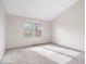 Bright bedroom featuring neutral walls, gray carpeting and a window offering natural light at 12527 Saksons Blvd, Fishers, IN 46038