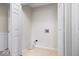 Laundry closet with hookups, white walls, white doors, and vinyl floor at 12527 Saksons Blvd, Fishers, IN 46038