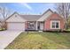 Charming home with a two-car garage, landscaped yard, and brick accents at 12527 Saksons Blvd, Fishers, IN 46038