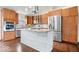 Modern kitchen with stainless steel appliances, island, and stylish cabinets at 12527 Saksons Blvd, Fishers, IN 46038