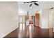 Open concept living area featuring hardwood floors and access to a modern kitchen with stainless steel appliances at 12527 Saksons Blvd, Fishers, IN 46038